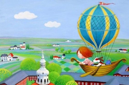 lille pige flyver i luftballon